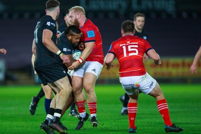 231021 - Ospreys v Munster - United Rugby Championship - Tom Botha of Ospreys is tackled by Jeremy Loughman of Munster