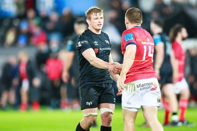 231021 - Ospreys v Munster - United Rugby Championship - Man of the Match Jac Morgan of Ospreys shakes the hand of Andrew Conway of Munster after the match