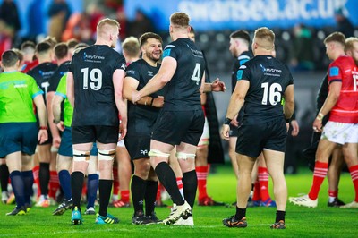 231021 - Ospreys v Munster - United Rugby Championship - Tom Botha and Bradley Davies of Ospreys celebrate after the match