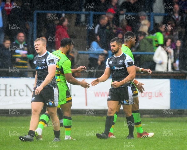 110818 - Ospreys v Northampton Saints - Preseason Friendly -  Players shake hands after the final whistle as the Ospreys are beaten 13-26 by Northampton