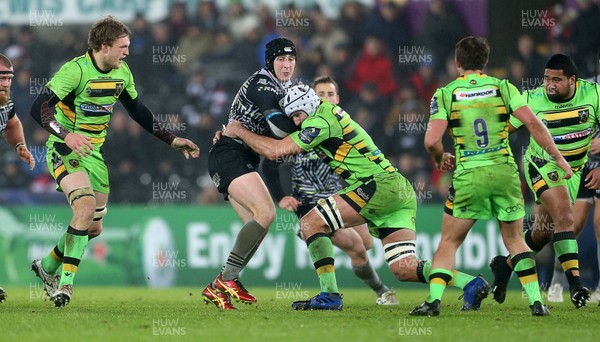 171217 - Ospreys v Northampton Saints - European Rugby Champions Cup -  Sam Davies of Ospreys is tackled by Michael Paterson of Northampton