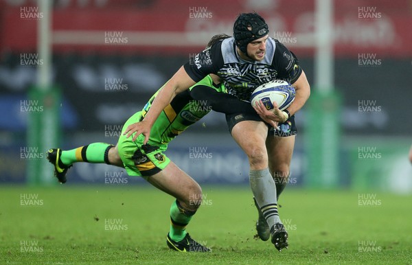 171217 - Ospreys v Northampton Saints - European Rugby Champions Cup - Dan Evans of Ospreys is tackled by Ben Foden of Northampton