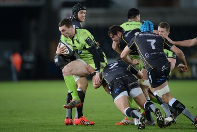 180115 - Ospreys v Northampton Saints - European Rugby Champions Cup -George North of Northampton is tackled by James King and Scott Baldwin of Ospreys