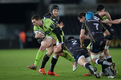 180115 - Ospreys v Northampton Saints - European Rugby Champions Cup -George North of Northampton is tackled by James King and Scott Baldwin of Ospreys