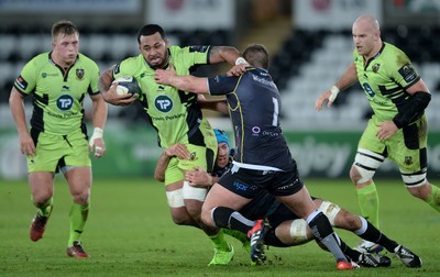 180115 - Ospreys v Northampton Saints - European Rugby Champions Cup -Samu Manoa of Northampton is tackled by Justin Tipuric and Marc Thomas of Ospreys