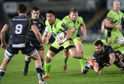 180115 - Ospreys v Northampton Saints - European Rugby Champions Cup -George Pisi of Northampton is tackled by Scott Baldwin of Ospreys