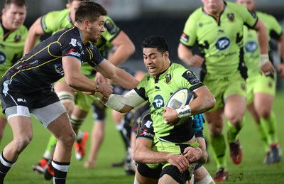 180115 - Ospreys v Northampton Saints - European Rugby Champions Cup -George Pisi of Northampton is tackled by Rhys Webb and Justin Tipuric of Ospreys