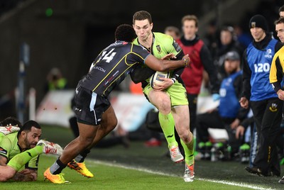 180115 - Ospreys v Northampton Saints - European Rugby Champions Cup -George North of Northampton is tackled by Aisea Natoga of Ospreys