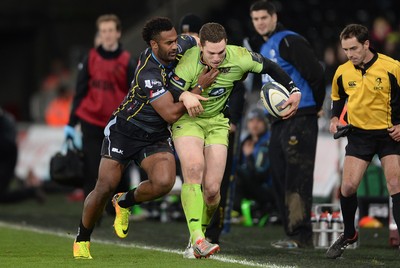 180115 - Ospreys v Northampton Saints - European Rugby Champions Cup -George North of Northampton is tackled by Aisea Natoga of Ospreys