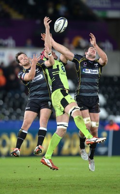 180115 - Ospreys v Northampton Saints - European Rugby Champions Cup -Dan Evans of Ospreys, Sam Dickinson of Northampton and Tyler Ardron of Ospreys compete for high ball