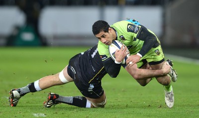 180115 - Ospreys v Northampton Saints - European Rugby Champions Cup -Ken Pisi of Northampton is tackled by Justin Tipuric of Ospreys