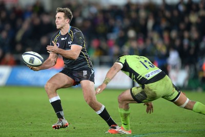 180115 - Ospreys v Northampton Saints - European Rugby Champions Cup -Ashley Beck of Ospreys is tackled by George Pisi of Northampton