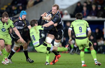 180115 - Ospreys v Northampton Saints - European Rugby Champions Cup -Alun Wyn Jones of Ospreys is tackled by Stephen Myler of Northampton