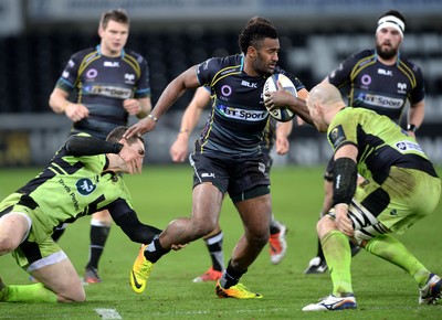 180115 - Ospreys v Northampton Saints - European Rugby Champions Cup -Aisea Natoga of Ospreys is tackled by George North and Sam Dickinson of Northampton