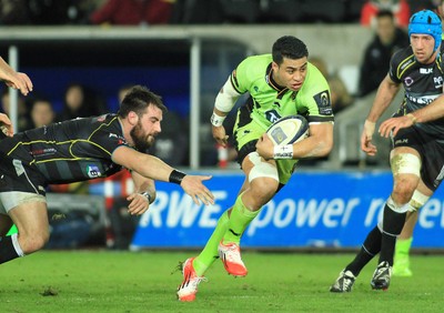 180115 - Ospreys v Northampton Saints - European Rugby Champions Cup -George Pisi of Northampton beats Scott Baldwin of Ospreys