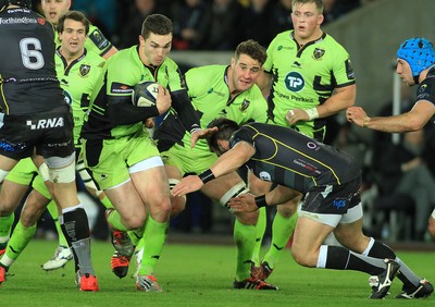 180115 - Ospreys v Northampton Saints - European Rugby Champions Cup -George North of Northampton takes on Scott Baldwin of Ospreys