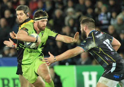 180115 - Ospreys v Northampton Saints - European Rugby Champions Cup -Tom Wood of Northampton takes on Gareth Thomas of Ospreys