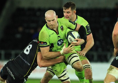 180115 - Ospreys v Northampton Saints - European Rugby Champions Cup -Sam Dickinson of Northampton is tackled by Tyler Ardron of Ospreys