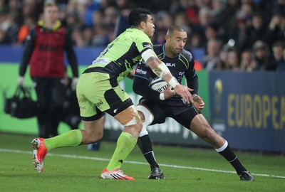 180115 - Ospreys v Northampton Saints, 2014-15 European Rugby Champions Cup - Ospreys Eli Walker is tackled by Northampton's George Pisi