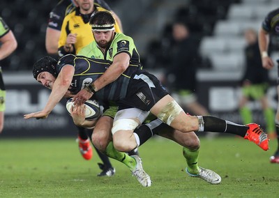 180115 - Ospreys v Northampton Saints, 2014-15 European Rugby Champions Cup - Ospreys James King is tackled by Northampton's Tom Wood