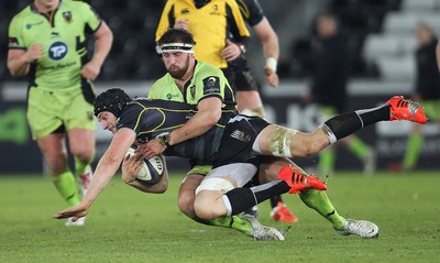 180115 - Ospreys v Northampton Saints, 2014-15 European Rugby Champions Cup - Ospreys James King is tackled by Northampton's Tom Wood