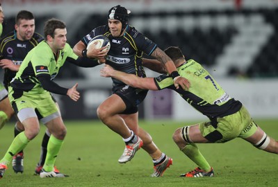 180115 - Ospreys v Northampton Saints, 2014-15 European Rugby Champions Cup - Ospreys Josh Matavesi takes on Northampton's Calum Clark