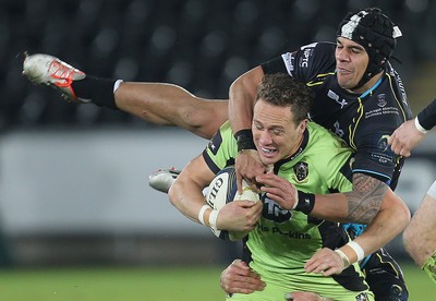 180115 - Ospreys v Northampton Saints, 2014-15 European Rugby Champions Cup - Northampton's James Wilson is tackled by Ospreys Josh Matavesi and Justin Tipuric