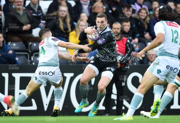 131018 - Ospreys v Pau - European Rugby Challenge Cup - George North of Ospreys is tackled by Marvin Lestremeau of Pau