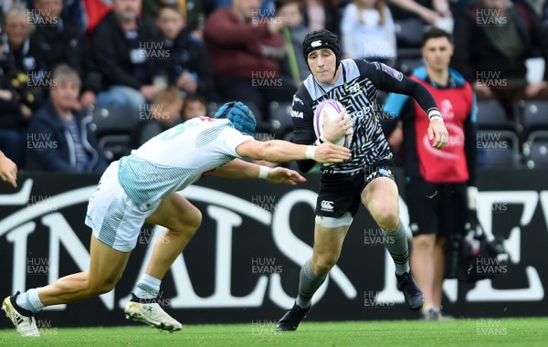 131018 - Ospreys v Pau - European Rugby Challenge Cup - Sam Davies of Ospreys is tackled by Mathias Colombet of Pau