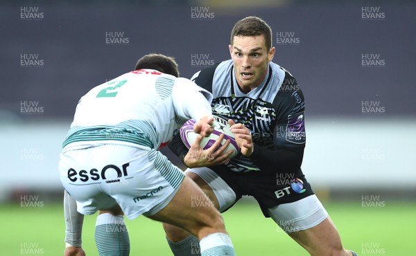 131018 - Ospreys v Pau - European Rugby Challenge Cup - George North of Ospreys is tackled by Laurent Bouchet of Pau
