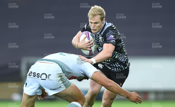 131018 - Ospreys v Pau - European Rugby Challenge Cup - Aled Davies of Ospreys is tackled by Atila Septar of Pau