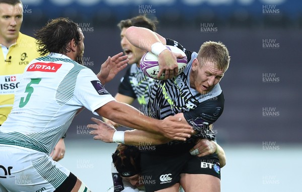 131018 - Ospreys v Pau - European Rugby Challenge Cup - Bradley Davies of Ospreys is tackled by Dan Malafosse and Sean Dougall of Pau