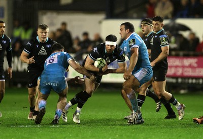 060424 - Ospreys v Sale Sharks - European Rugby Challenge Cup - Owen Williams of Ospreys is tackled by Ben Curry of Sale 