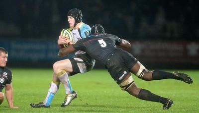 071114 - Ospreys v Saracens - LV= Cup -Dafydd Howells of Ospreys is tackled by Mario Itoje of Saracens