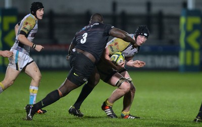 071114 - Ospreys v Saracens - LV= Cup -Adam Beard of Ospreys is tackled by Biyi Alo of Saracens