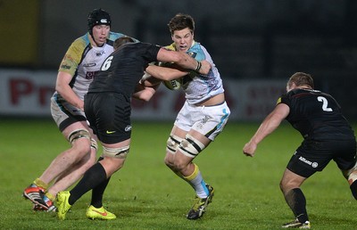 071114 - Ospreys v Saracens - LV= Cup -Tommy Spink of Ospreys is tackled by Hayden Thompson-Stringer of Saracens