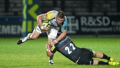 071114 - Ospreys v Saracens - LV= Cup -Matthew Dwyer of Ospreys is tackled by Max Wilkins of Saracens