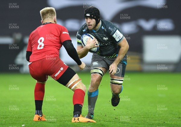 110120 - Ospreys v Saracens - European Rugby Champions Cup - Morgan Morris of Ospreys is tackled by Jackson Wray of Saracens