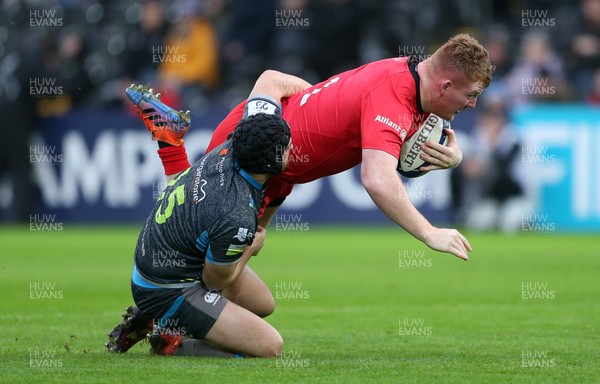 110120 - Ospreys v Saracens - European Rugby Champions Cup - Rhys Carre of Saracens is tackled by Dan Evans of Ospreys
