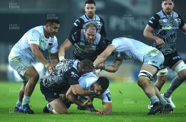 130118 - Ospreys v Saracens - European Rugby Champions Cup - Billy Vunipola of Saracens is tackled by Nicky Smith of Ospreys
