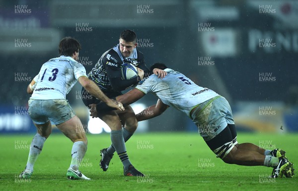 130118 - Ospreys v Saracens - European Rugby Champions Cup - Owen Watkin of Ospreys is tacked by Will Skelton of Saracens