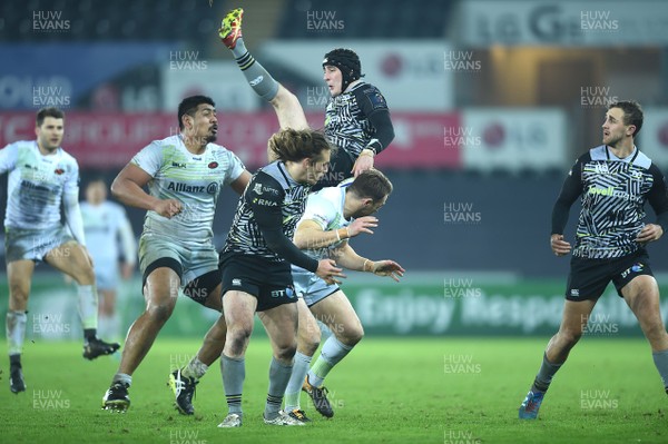 130118 - Ospreys v Saracens - European Rugby Champions Cup - Sam Davies of Ospreys is taken out in the air by Chris Wyles of Saracens