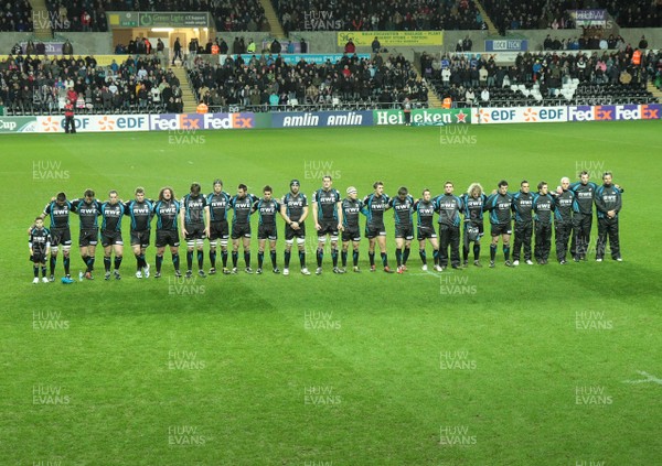 16.12.11 Ospreys v Saracens - Heineken Cup - Ospreys hold a minute's silence to pay their respects to Huw Evans on the passing away of his wife  