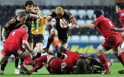 02.04.10 - Ospreys v Scarlets - Magners League - Jerry Collins of Ospreys jumps through. 