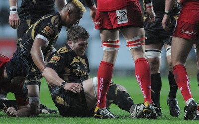 02.04.10 - Ospreys v Scarlets - Magners League - Richard Hibbard of Ospreys feels an injury before going off. 