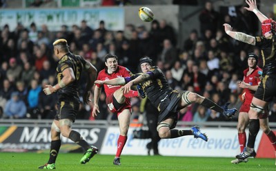 02.04.10 - Ospreys v Scarlets - Magners League - Stephen Jones of Scarlets has his drop goal charged down by Ryan Jones of Ospreys. 