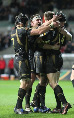 02.04.10 ... Ospreys v Scarlets, Magners League -  Tommy Bowe of Ospreys is congratulated by teammates after scoring the winning try 