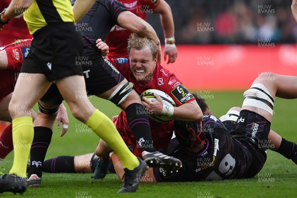 060425 - Ospreys v Scarlets -  EPCR Challenge Cup Round of 16 -  Blair Murray of Scarlets is challenged by James Fender of Ospreys