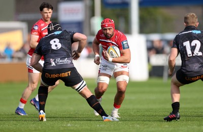 090526 - Ospreys v Scarlets - United Rugby Championship - Josh Macleod of Scarlets is challenged by Morgan Morris of Ospreys 