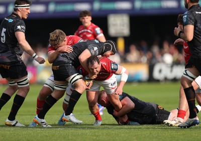 090526 - Ospreys v Scarlets - United Rugby Championship - Ryan Elias of Scarlets is tackled by Morgan Morris of Ospreys 